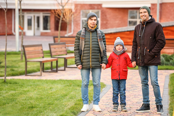 Male gay couple with adopted boy outdoors - Zdjęcie, obraz