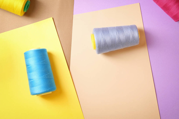 Set of sewing threads on color background - Photo, image