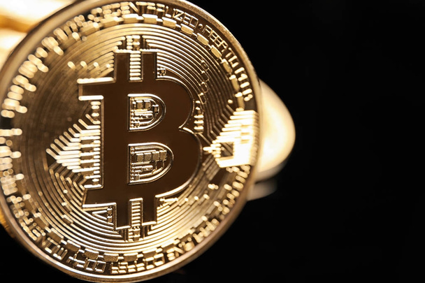 Golden bitcoin on black   - Φωτογραφία, εικόνα