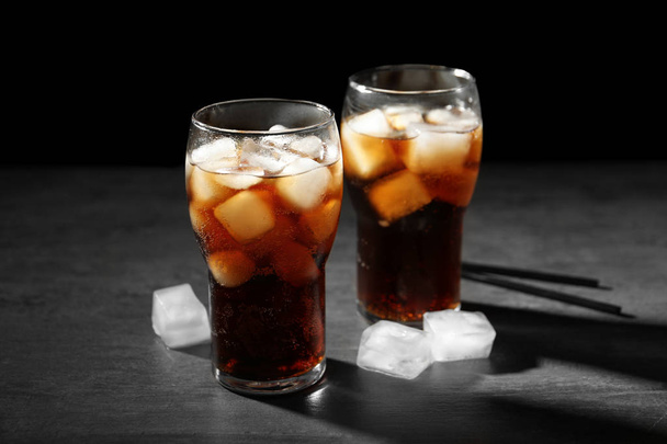 Cold cola in glasses on dark background - Φωτογραφία, εικόνα