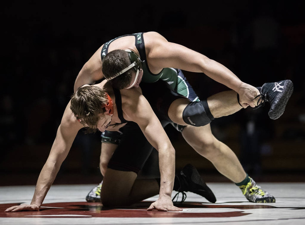 Wrestling under the spotlight with Red Bluff High School vs. Foothill in Palo Cedro, California. January 10, 2018 - Foto, Imagen