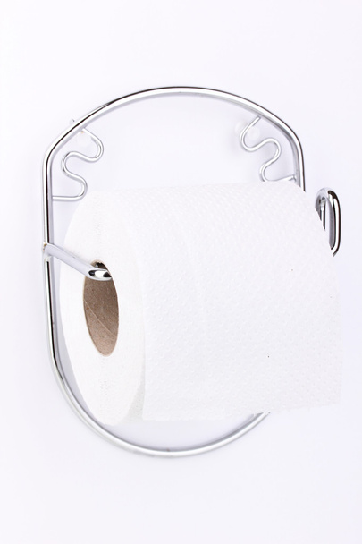 Roll of toilet paper on holder fixed to wall isolated on white - Fotografie, Obrázek