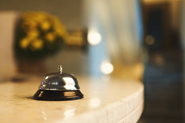 Hotel accommodation call bell on reception desk - Photo, Image