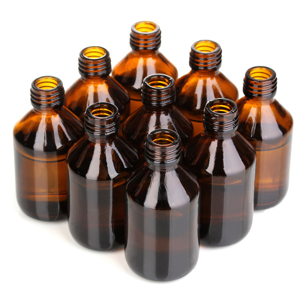 Медичні пляшки в ряд ізольовані на білому
 - Фото, зображення