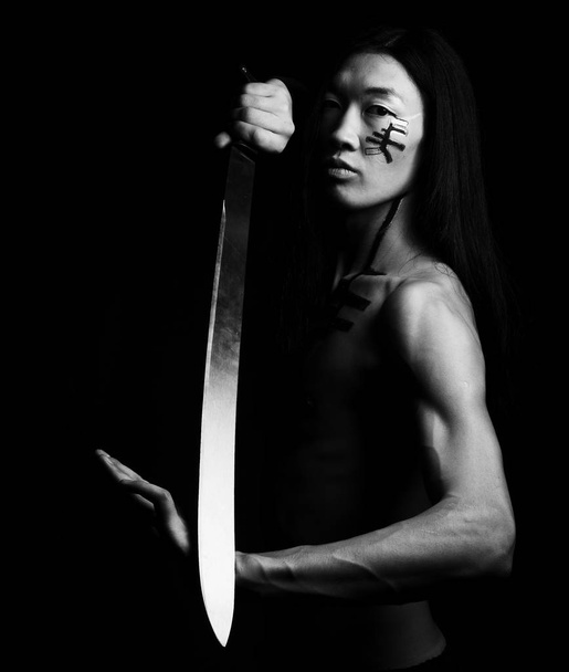 asian man over black background - Valokuva, kuva