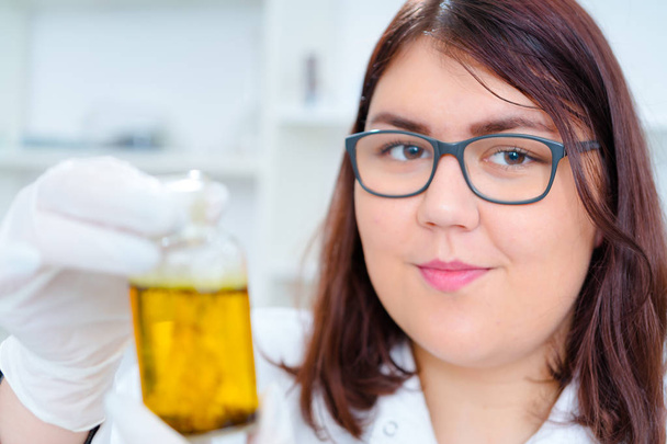 Girl teen in the laboratory of food quality tests.. - Φωτογραφία, εικόνα