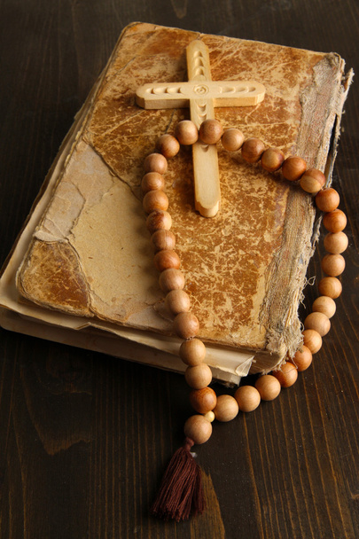 Bible, rosary and cross on wooden table close-up - Foto, Imagen
