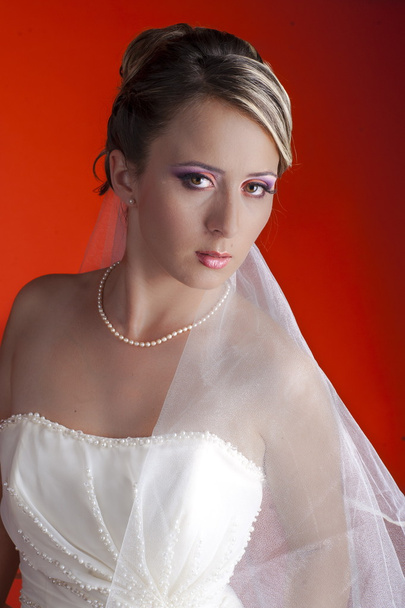 Bride over the orange background - Valokuva, kuva