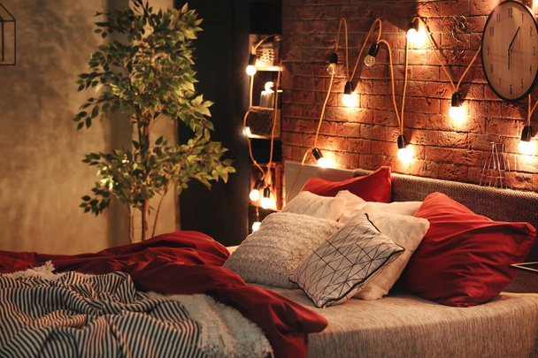 Comfortable bed with pillows in room - Photo, image