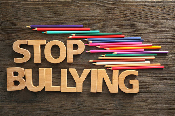 Text "Stop bullying" on wooden background - Фото, зображення