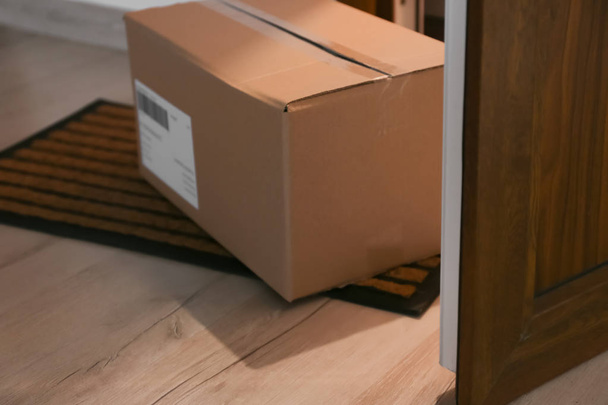 Parcel box on floor near open door - Photo, Image