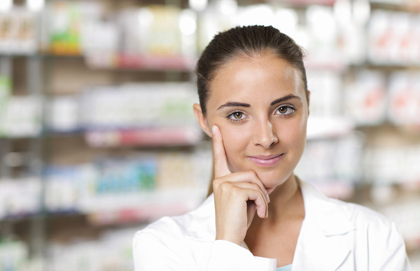 Portrait of Smiling Woman Pharmacist in Pharmacy - Foto, immagini