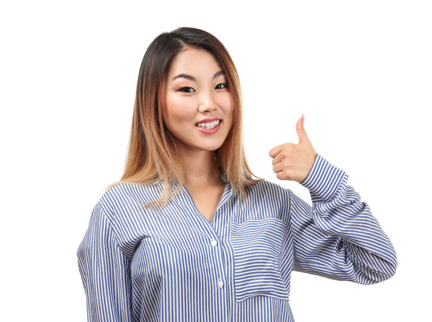 Smiling woman showing thumb-up  - Photo, Image