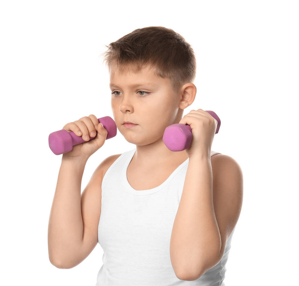 Overweight boy with dumbbells on white background - Foto, afbeelding