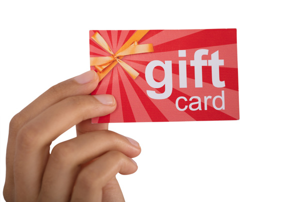 Close-up Of Person's Hand Holding Gift Card Against White Background - 写真・画像