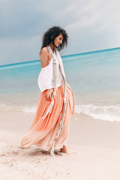 beautiful young stylish woman in pink skirt on the beach - Zdjęcie, obraz