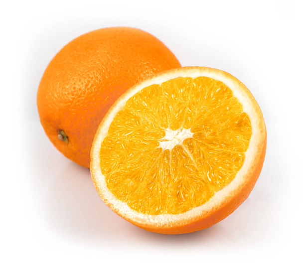 Whole orange fruits and orange fruit slices isolated on white background cutout - Foto, afbeelding