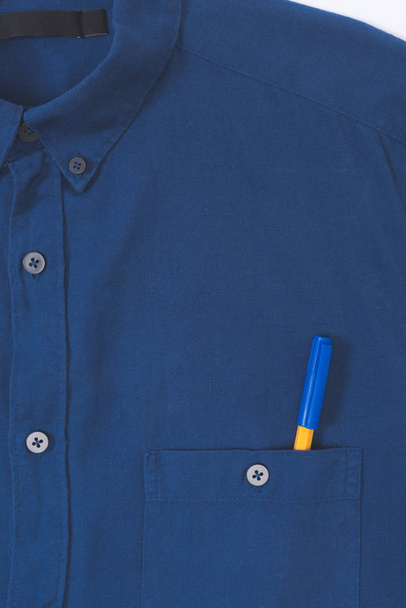 close-up view of stylish blue shirt with pen in pocket  - 写真・画像