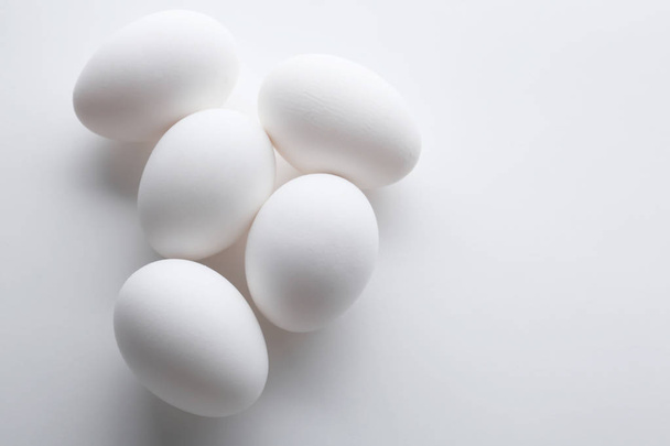 Chicken eggs on white   - Foto, Bild