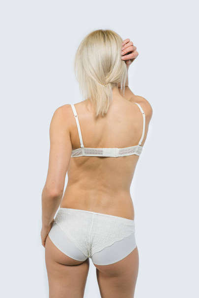 Snap Blonde model Woman in white underwear - 写真・画像