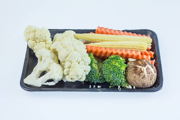 Total vegetables on black tray, white broccoli,  - Фото, изображение