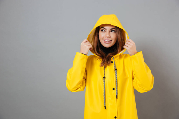 Portrait of a smiling girl dressed in raincoat - Foto, Imagem