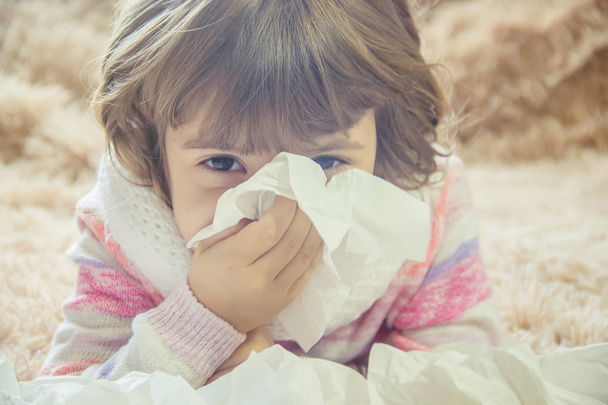 Cold at the child. Runny nose. Selective focus.  - Photo, Image