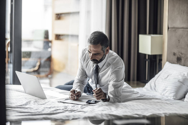 Businessman Working at Hotel Room - Photo, image