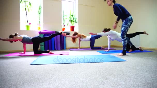 In yoga session trainer learns to keep strap correctly - Footage, Video