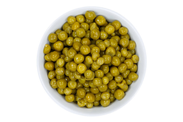 Green peas from above bowl isolated on white - Valokuva, kuva