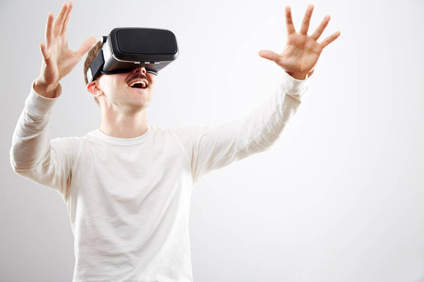 Man wearing virtual reality device - Fotó, kép
