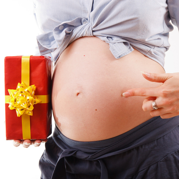 Pregnant woman with a present - Fotografie, Obrázek