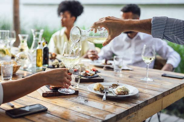 People Enjoying Wine at Restaurant - Zdjęcie, obraz