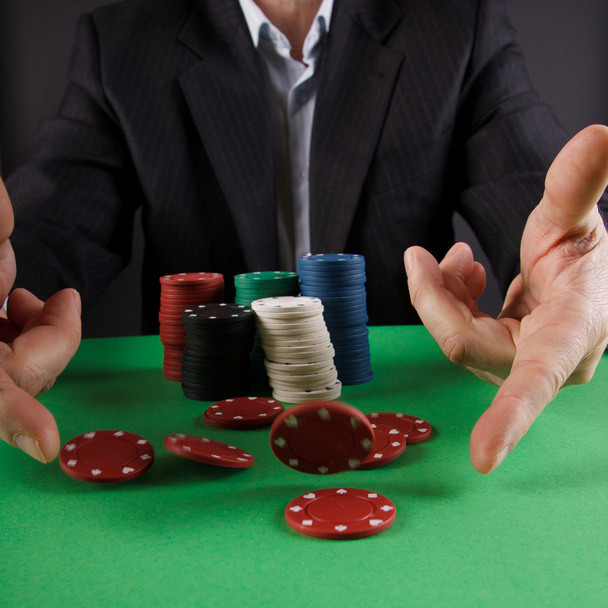 Businessman playing poker - Fotó, kép