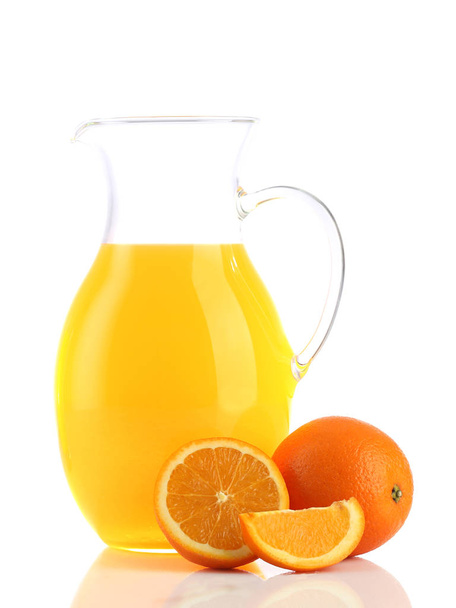 Orange juice in pitcher. Isolated on white background Stock Photo