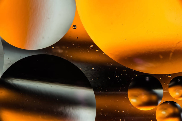 mixing water and oil, beautiful color abstract background based on circles and ovals, macro abstraction - Photo, image