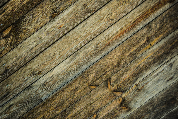 background of brown  wooden  flooring with boards. Wooden decking planks close up. - Fotó, kép