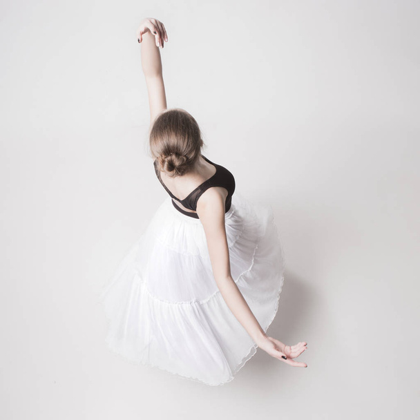 The top view of the teen ballerina on white background - Foto, Bild