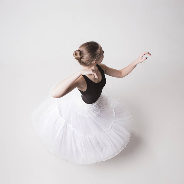 The top view of the teen ballerina on white background - Foto, imagen