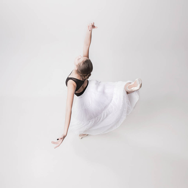 The top view of the teen ballerina on white background - Photo, Image