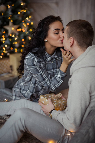 Falimy, love, winter, holidays - happy couple at christmas decorations - Foto, imagen