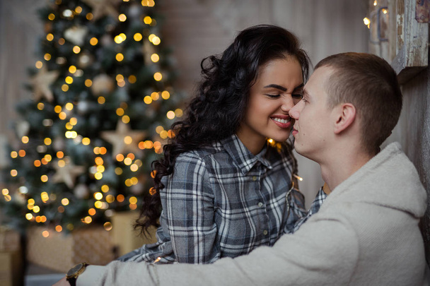 Falimy, love, winter, holidays - happy couple at christmas decorations - Photo, image