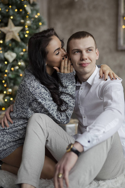Falimy, love, winter, holidays - happy couple at christmas decorations - Fotó, kép