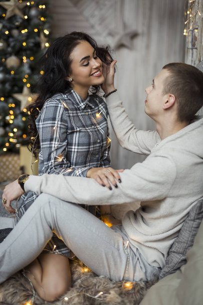 Falimy, love, winter, holidays - happy couple at christmas decorations - Φωτογραφία, εικόνα