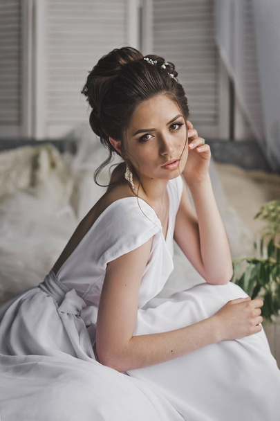 Portrait of a beautiful girl in a long white dress 8766. - Photo, image