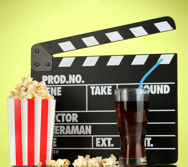 Movie clapperboard, cola and popcorn on background - Foto, imagen