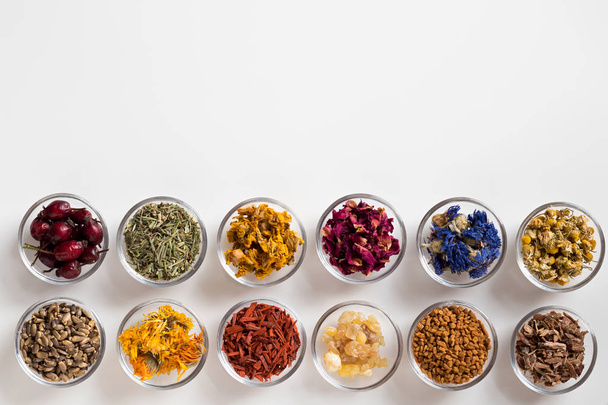 Selection of dried herbs on a white background with copy space, top view - Photo, Image