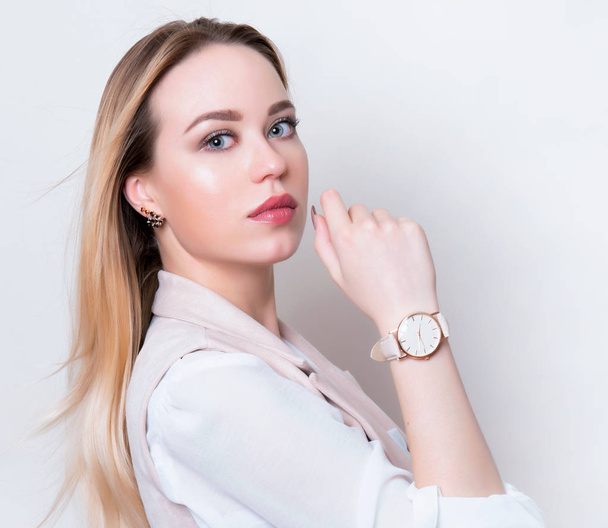 beautiful young woman with long hair wearing wrist watch - Fotografie, Obrázek