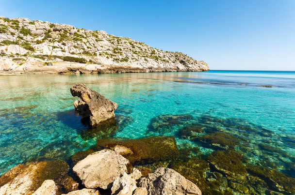 Turquoise water of Cala San Vicente beach, Majorca island, Spain - Fotó, kép