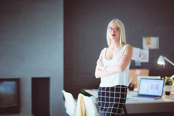 Portrait of an executive professional mature businesswoman sitting on office - Fotoğraf, Görsel